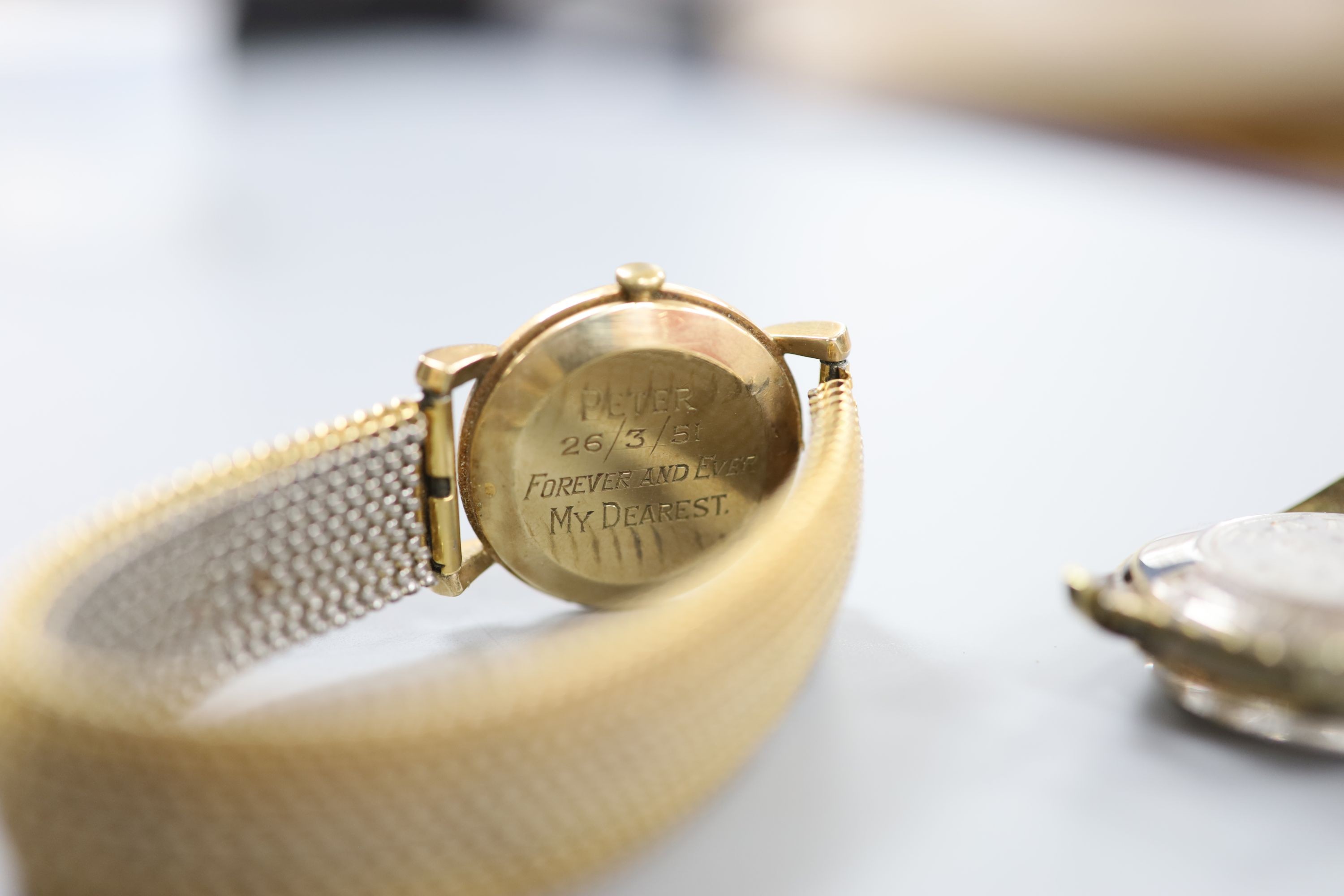 A gentleman's 9ct gold Baume manual wind wrist watch, on a gilt metal flexible strap and a gentleman's steel Rado Gren Horse wrist watch, no strap.